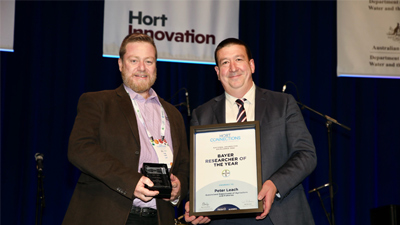 Tony May presents Peter Leach with Bayer Researcher of the Year award